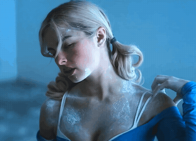 A Woman With White Powder On Her Face GIF