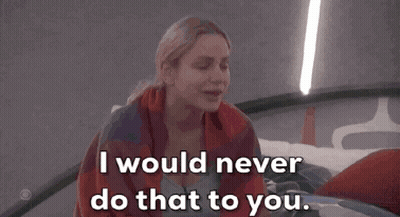 A Woman Wrapped In A Plaid Blanket Says " I Would Never Do That To You " GIF