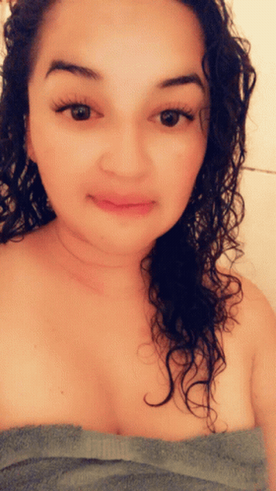 Woman Wrapped In Towel Looking At Camera GIF