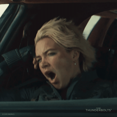 A Woman Yawning In A Car With Thunderbolts On The Bottom GIF