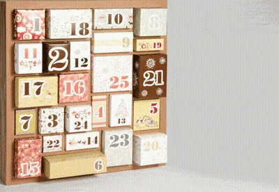 A Wooden Advent Calendar With Boxes Labeled With The Numbers 1 Through 20 GIF