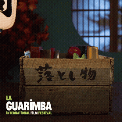 A Wooden Box With Chinese Writing On It And The Words La Guarimba International Film Festival GIF
