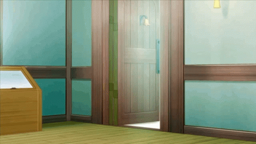 A Wooden Door Is Open In A Room With A Display Case GIF