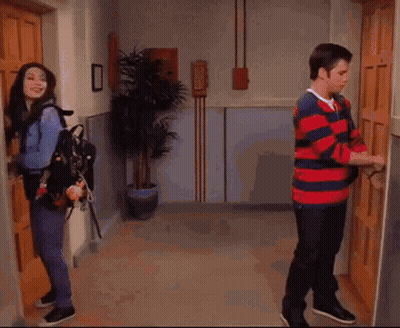 A Wooden Door Is Open To A Room With A Blue Umbrella Hanging On The Wall . GIF