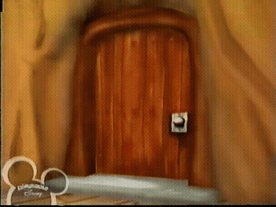 A Wooden Door With A Disney Logo On The Bottom GIF