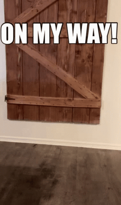 A Wooden Door With The Words " On My Way " Written On It GIF