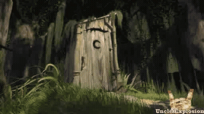 A Wooden Outhouse In The Middle Of A Forest With A Cat Standing In Front Of It . GIF