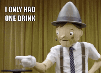 A Wooden Puppet Is Pointing At A Glass With The Words I Only Had One Drink Below Him GIF