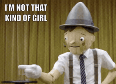 A Wooden Puppet Says I 'M Not That Kind Of Girl While Pointing A Gun GIF