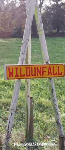 A Wooden Sign That Says Wildunfall On It GIF