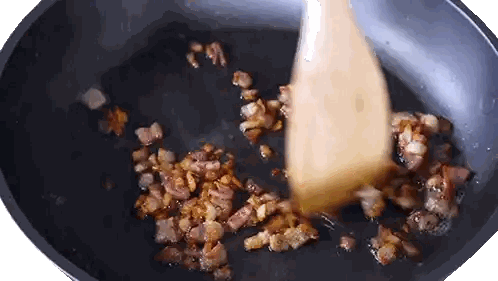 A Wooden Spoon Is Stirring Bacon In A Frying Pan . Sticker