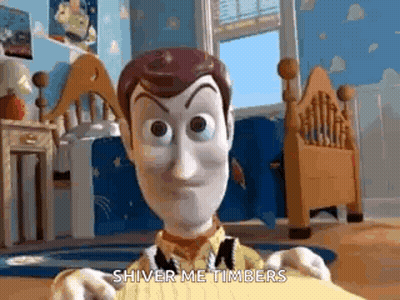 A Woody Doll From Toy Story Is Holding A Piece Of Paper In A Bedroom . GIF