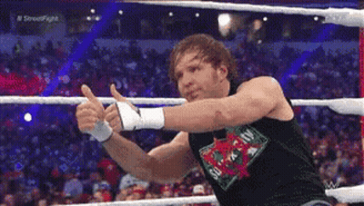 A Wrestler Giving A Thumbs Up In A Ring GIF