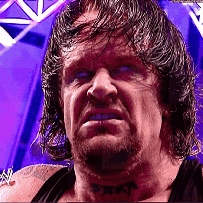 A Wrestler Has A Tattoo On His Neck That Says ' Reign ' GIF