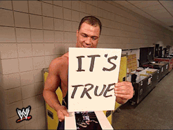 A Wrestler Holds Up A Sign That Says It 'S True GIF