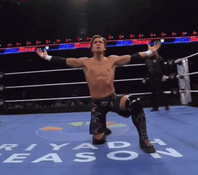 A Wrestler In A Ring With The Word Riyadh Written On The Floor GIF