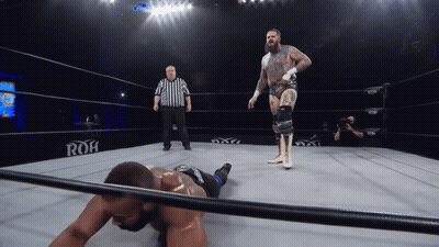A Wrestler In A Ring With The Word Roh On The Wall GIF