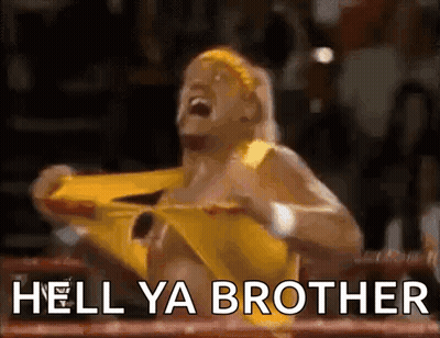 A Wrestler In A Yellow Outfit Is Screaming In A Boxing Ring With The Words Hell Ya Brother Written Below Him . GIF