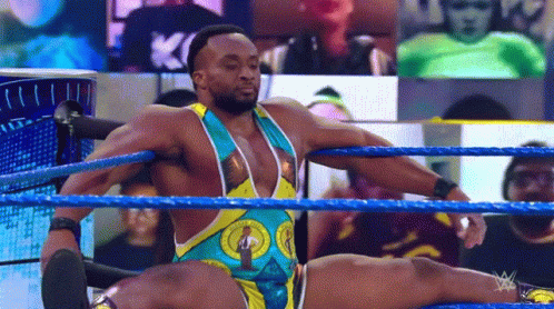 A Wrestler Is Doing A Split In The Ring During A Wrestling Match . GIF