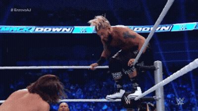 A Wrestler Is Jumping Over A Rope While Another Wrestler Is Watching GIF