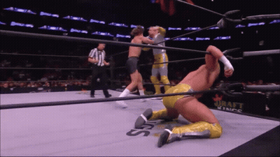 A Wrestler Is Kneeling Down In A Ring With The Word Draft Kings On The Side GIF