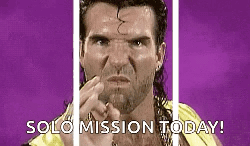 A Wrestler Is Pointing At The Camera With The Words `` Solo Mission Today '' . GIF