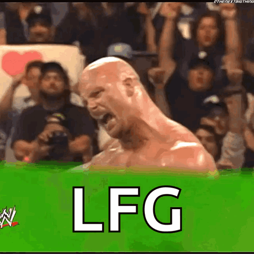 A Wrestler Is Screaming In Front Of A Crowd And The Word Lfg Is On The Green Background GIF