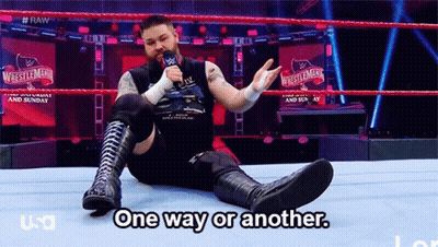 A Wrestler Is Sitting On The Ground In A Wrestling Ring Talking Into A Microphone And Says One Way Or Another GIF