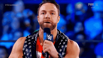 A Wrestler Is Speaking Into A Microphone During A Fox Live Event GIF