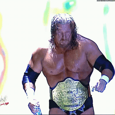 A Wrestler Is Wearing A Belt That Says ' Triple H ' On It GIF