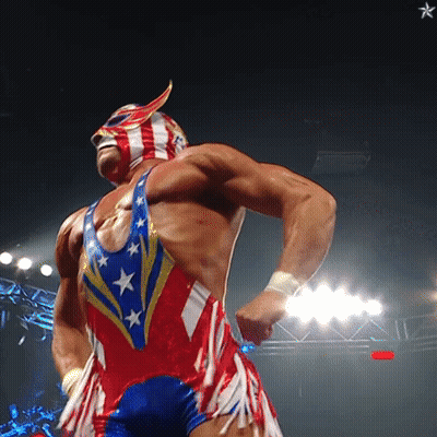 A Wrestler Is Wearing A Red White And Blue Outfit And A Mask GIF