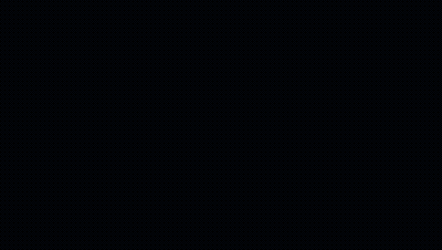 A Wrestler Kicking Another Wrestler In A Wrestling Ring With A Crowd In The Background GIF