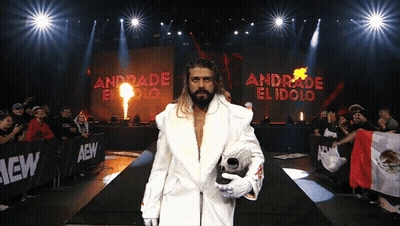 A Wrestler Named Andrade El Idolo Walks Down A Ramp GIF