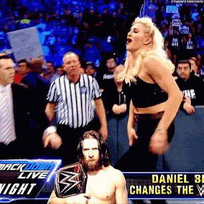 A Wrestler Named Daniel Bryan Is Holding A Wrestling Championship Belt GIF