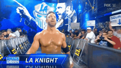 A Wrestler Named La Knight Stands In Front Of A Crowd At A Smack Down Event GIF