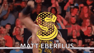 A Wrestler Named Matt Eberflus Is Standing In Front Of A Crowd GIF