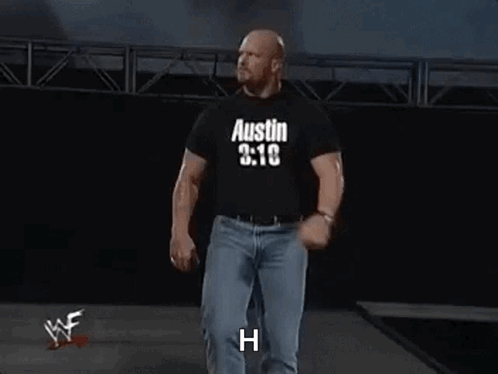 A Wrestler Wearing A Black Shirt That Says `` Austin 3:16 '' Is Walking Down A Ramp . GIF