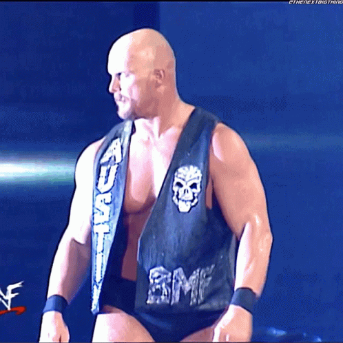 A Wrestler Wearing A Black Vest With The Word Smp On It GIF