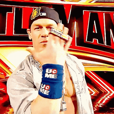 A Wrestler Wearing A Hat And Wristbands That Say Uc On Them GIF
