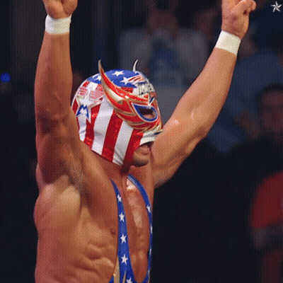 A Wrestler Wearing A Mask That Says " America " On It GIF