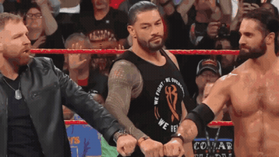 A Wrestler Wearing A We Fight We Overcome Shirt GIF