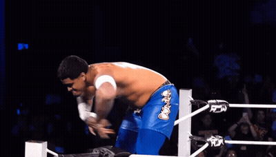 A Wrestler Wearing Blue Shorts With The Word Fox On The Side GIF
