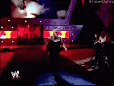 A Wrestler With The Word Hulk On His Shirt Walks Down The Ramp GIF