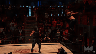 A Wrestling Match Is Being Filmed By A Camera With The Hashtag #Luchaunderground GIF