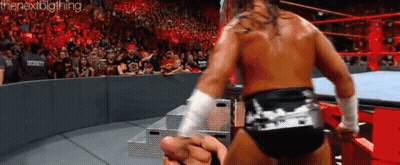 A Wrestling Match Is Going On In Front Of A Crowd And The Words Thenextbigthing Are On The Bottom GIF