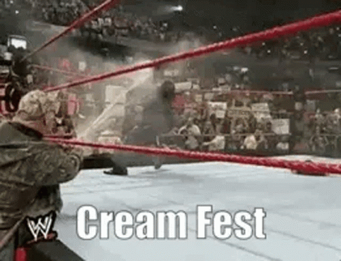 A Wrestling Match Is Taking Place In A Ring With The Words Cream Fest Written On The Bottom GIF