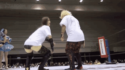 A Wrestling Ring With A Sign That Says Brush Road GIF