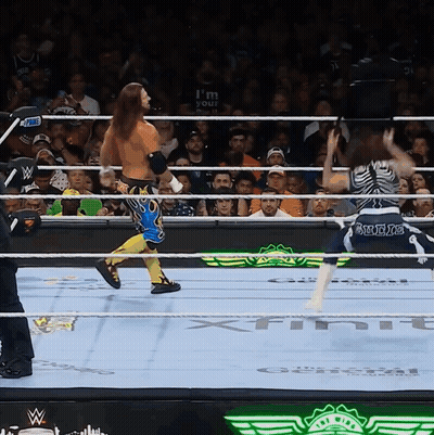 A Wrestling Ring With A Sign That Says ' I 'M Your ' On It GIF