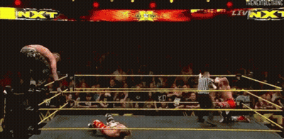 A Wrestling Ring With A Sign That Says Nxt GIF