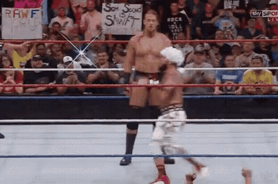 A Wrestling Ring With A Sign That Says Rawf GIF